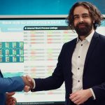 Two Power Apps developers shaking hands after project completion